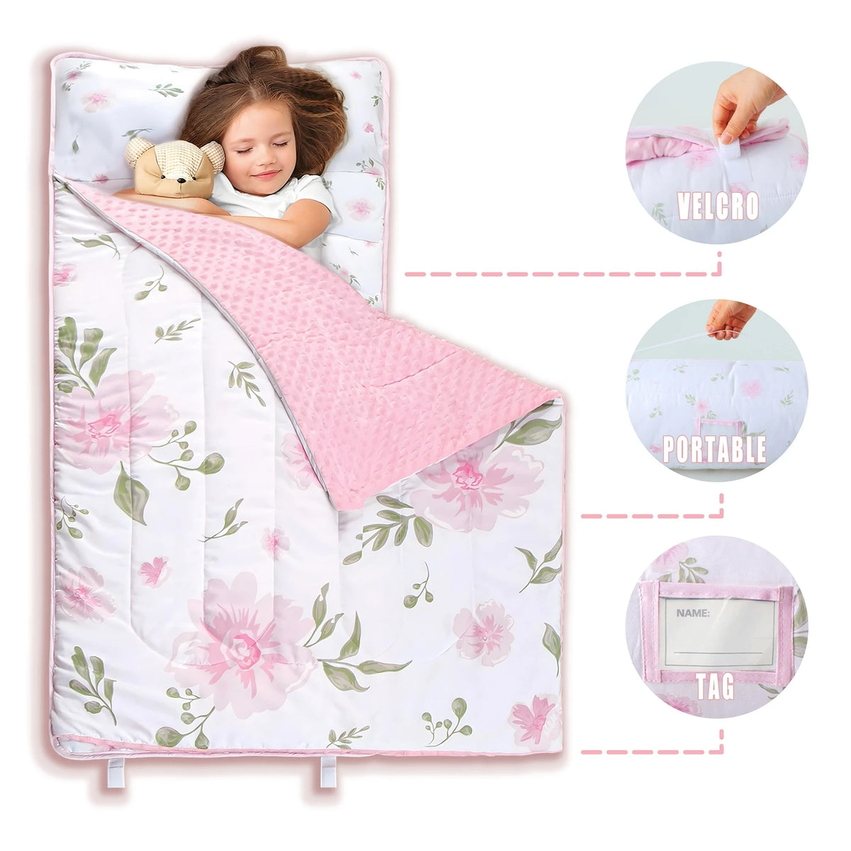 A pink toddler nap mat set featuring a floral pattern, a pillow, and a blanket with velcro and tag features.