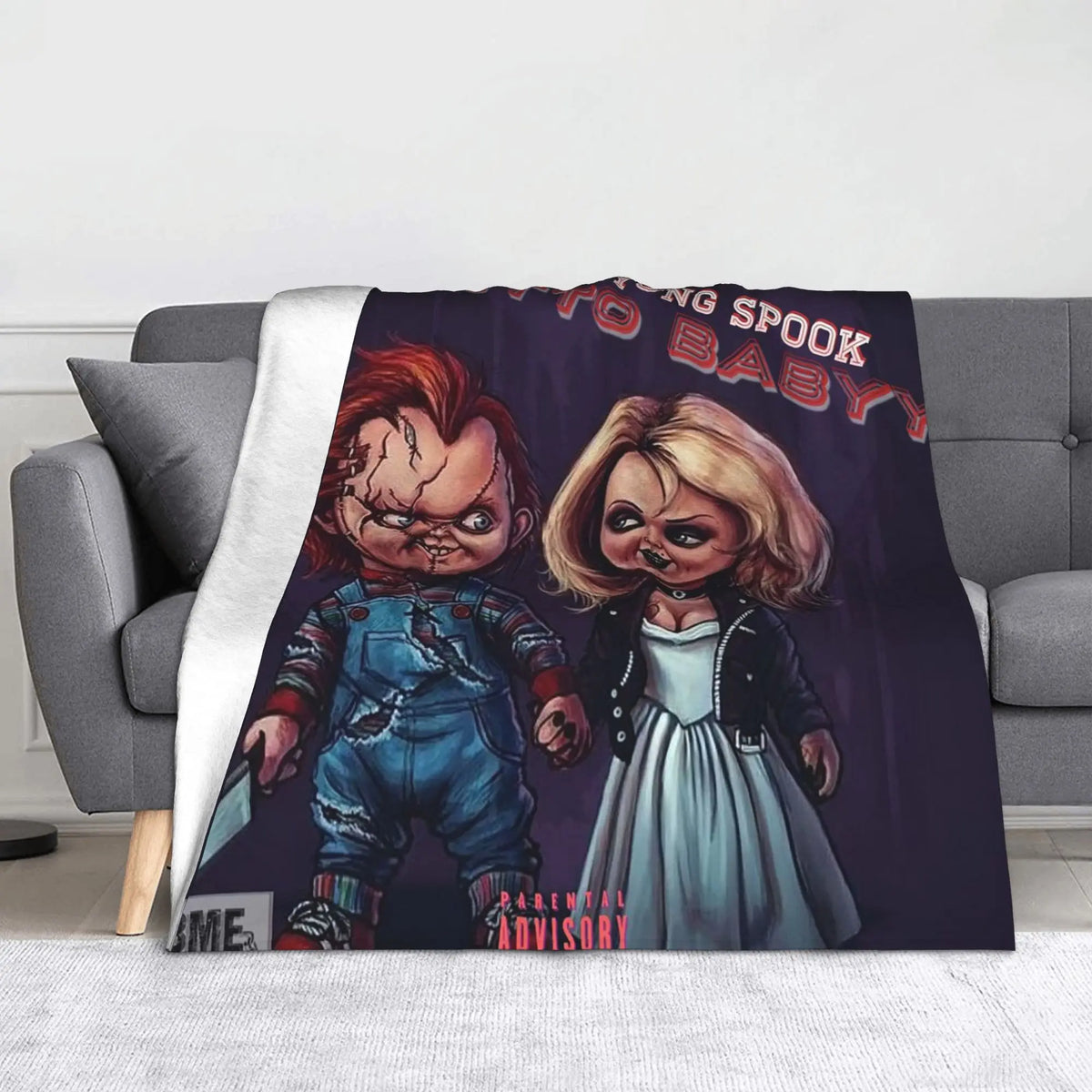 A dark purple graphic featuring Chucky with a baby, suitable for a flannel throw blanket.