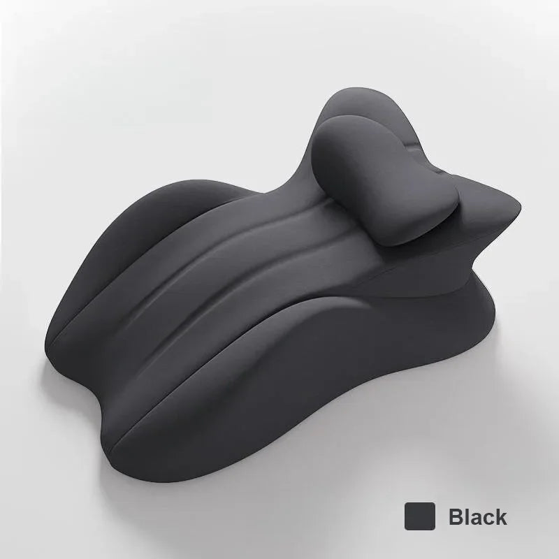 A black ergonomic memory foam wedge pillow shown from a side angle.