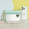 A light green PU leather coin purse with a wrist strap and a white smartphone is displayed on a wooden surface.