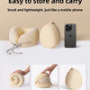 A beige U-shaped memory foam travel neck pillow shown in various stages of storage and carrying.