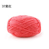 A ball of bright coral pink matte chenille yarn for knitting and crochet.