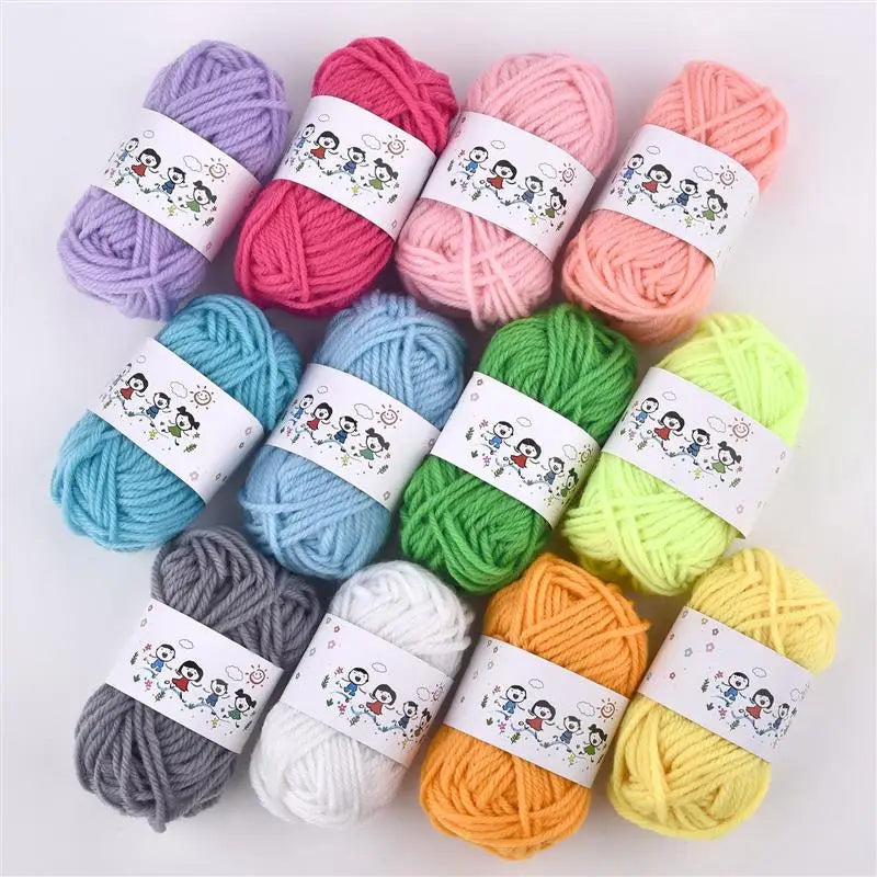 A collection of twelve colors of soft acrylic yarn skeins arranged on a white background.