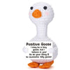 A white plush goose toy with an orange beak and feet, featuring a positive message.