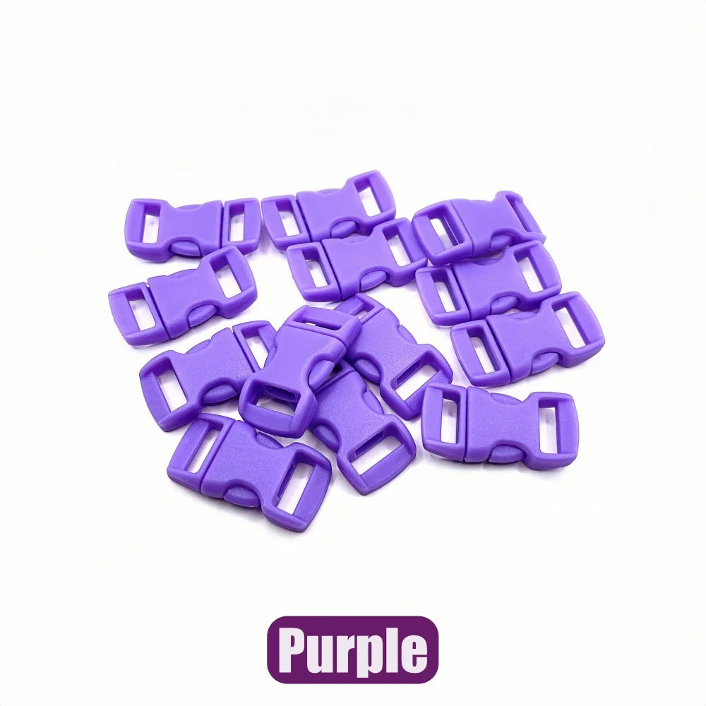 A pile of purple adjustable plastic paracord buckle bracelets.