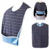 A plaid waterproof mealtime bib in blue and black fabric shown on a person and as a standalone product.