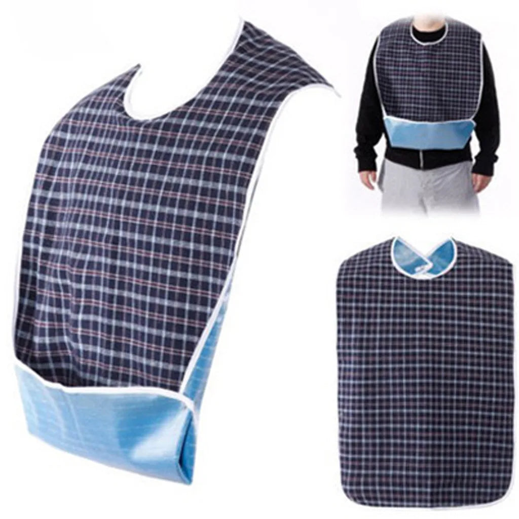 A plaid waterproof mealtime bib in blue and black fabric shown on a person and as a standalone product.