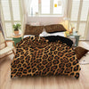 Leopard print duvet cover set featuring a brown and black animal print on a bed with matching pillows.
