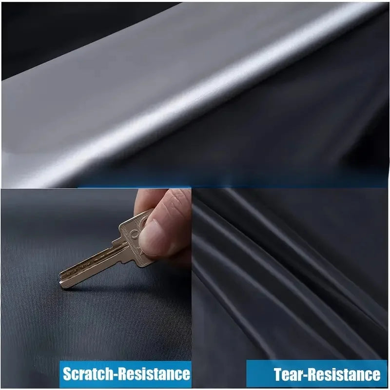 Close-up of a metal key demonstrating scratch and tear resistance on a dark fabric surface.