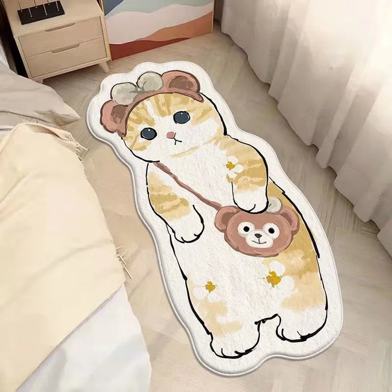 A cute cartoon plush mat featuring a sleepy orange and white cat with pink ears and a brown bear face.
