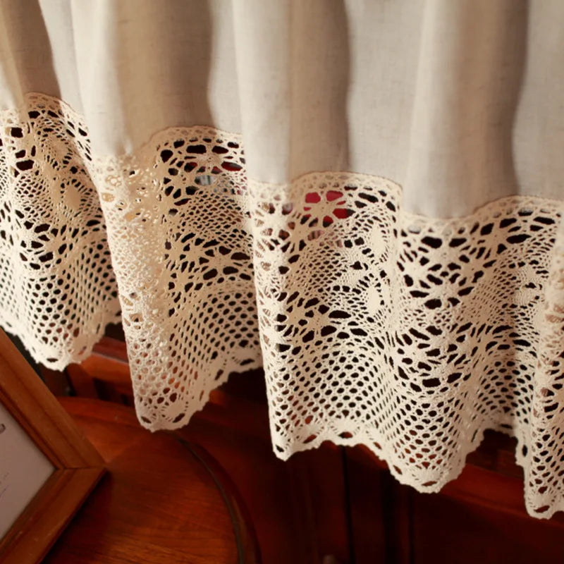 A white crochet half curtain with a linen weave hangs in a soft, natural light.