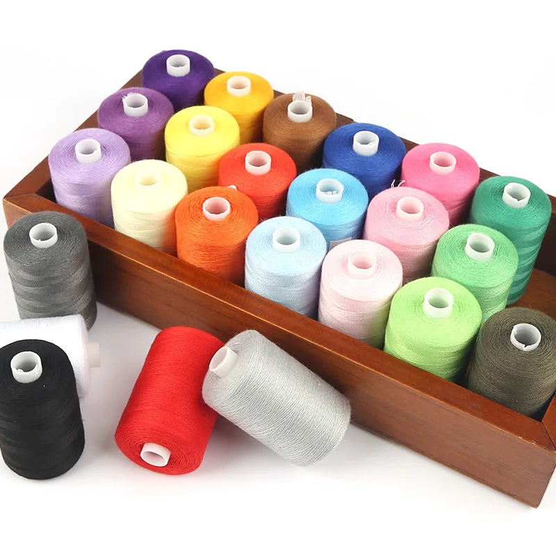 A wooden box filled with various colored polyester thread spools for sewing and quilting.