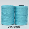 Two spools of teal blue hand knitting and crochet cord for crafting