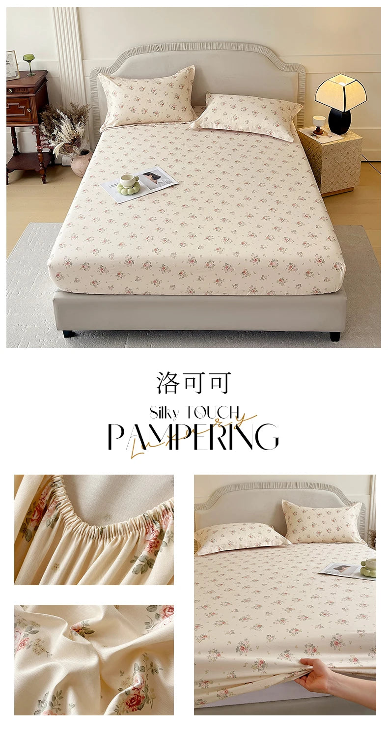 A bed with a floral printed cotton fitted sheet and pillows, emphasizing silky touch pampering.
