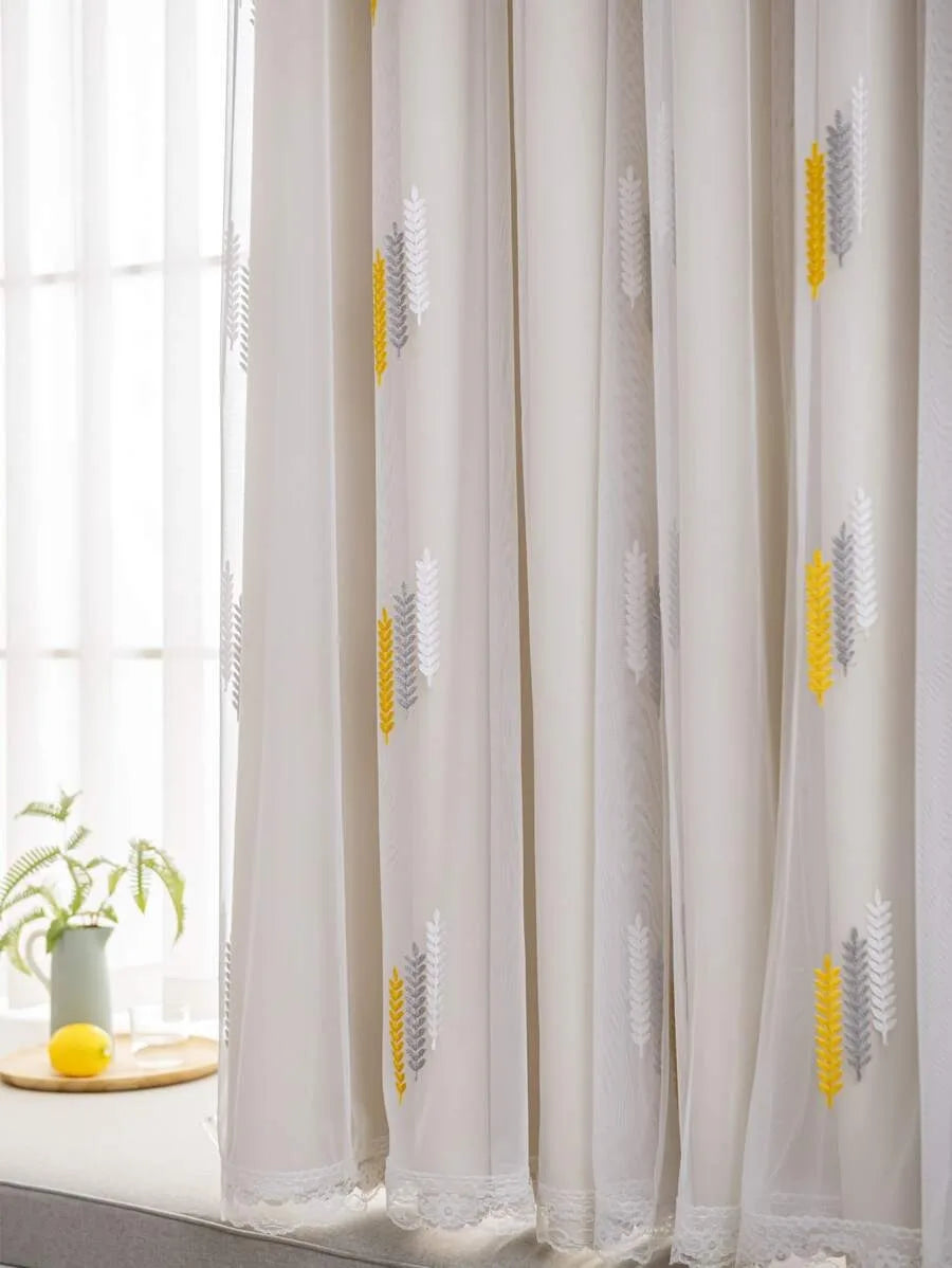 Elegant wheat field embroidered white and gray sheer curtain hanging by a window