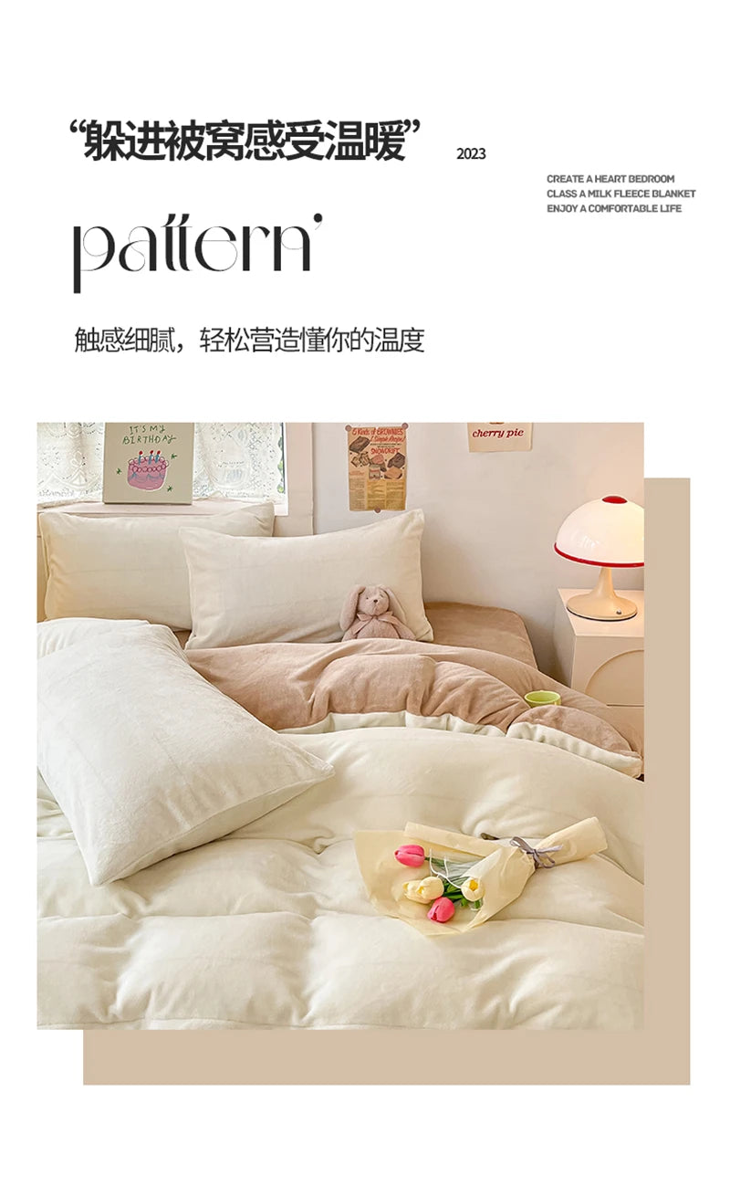A close-up of a beige milk fleece blanket and duvet set with soft pillows and a pink lamp on a light-colored bed.