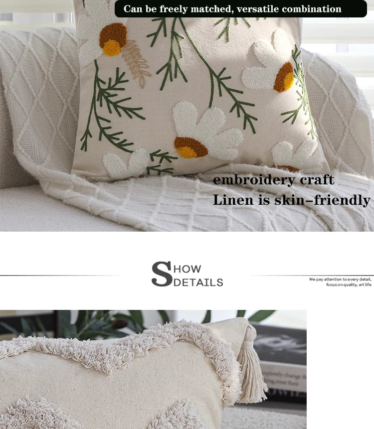 A beige cushion cover with green and yellow floral embroidery on a white background.