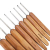 A set of wooden bamboo crochet and knitting needles with varying sizes.