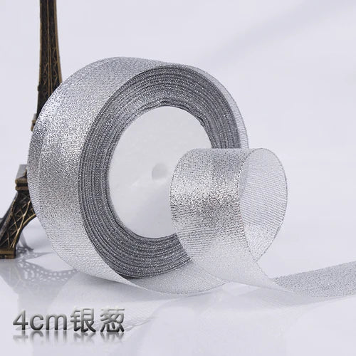 Roll of silver glitter organza ribbon for gift wrapping and DIY crafts