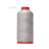 A spool of gray heavy duty nylon sewing thread with a red cap.