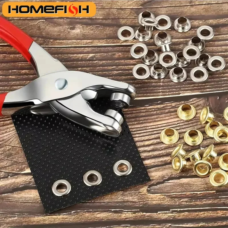 A silver pliers tool is shown next to a black circuit board and several metal eyelets.