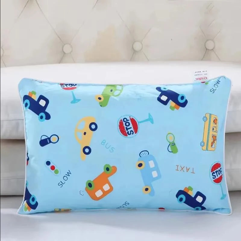 Light blue cartoon style children's pillowcase featuring various vehicles like a bus, taxi, and car.