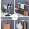 A collection of nail-free adjustable curtain rod hooks and hangers for various kitchen tools like spatulas, graters, and wood