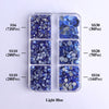 A clear plastic tray containing various sizes of light blue glass rhinestones categorized by SS6, SS10, SS16, SS20, and SS30.