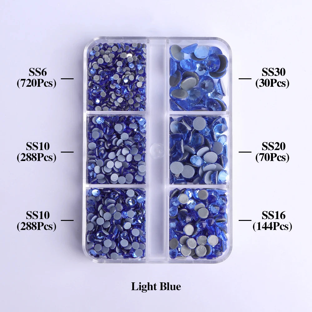 A clear plastic tray containing various sizes of light blue glass rhinestones categorized by SS6, SS10, SS16, SS20, and SS30.