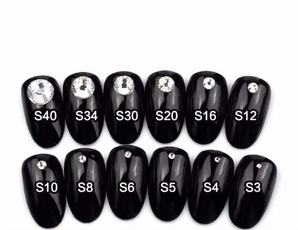 A set of black acrylic nails featuring crystal AB flatback rhinestones for crafts and decor.