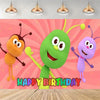 A vibrant cartoon green character with large eyes and limbs stands against a pink background with a happy birthday message.