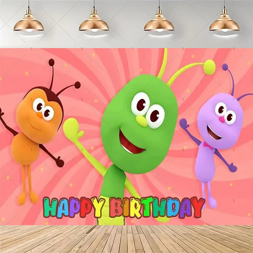 A vibrant cartoon green character with large eyes and limbs stands against a pink background with a happy birthday message.