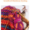 A close-up of vibrant gradient rainbow dyed wool yarn skeins used for hand knitting projects.