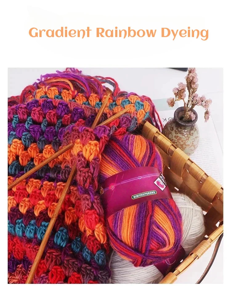 A close-up of vibrant gradient rainbow dyed wool yarn skeins used for hand knitting projects.