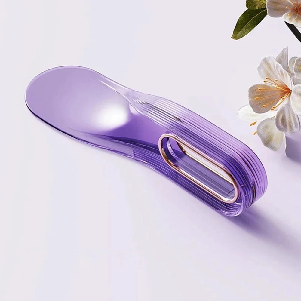 A purple mattress lifter wedge tool is shown on a light surface.