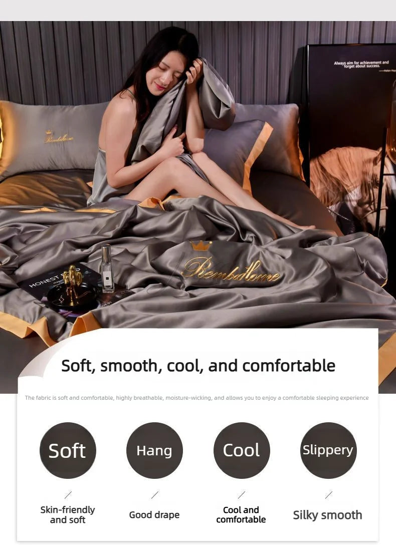 A woman relaxing on a gray ice silk blanket set with pillows and a decorative pouch.