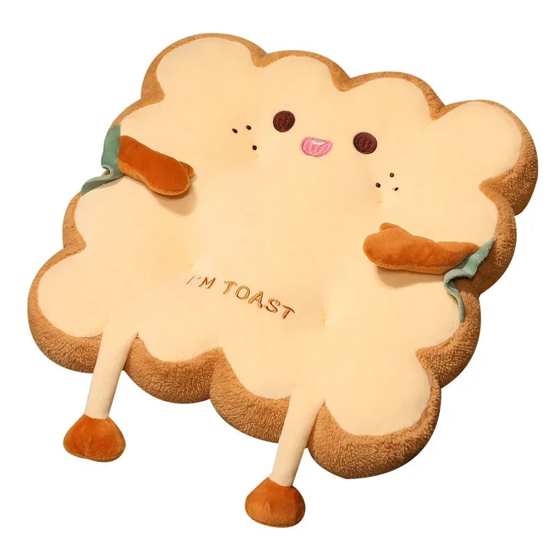 A plush cartoon character shaped like a piece of toast with a face and text reading I'M TOAST.