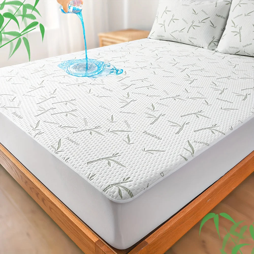 A white bamboo fiber fitted sheet is shown on a bed, with water dripping onto the surface.