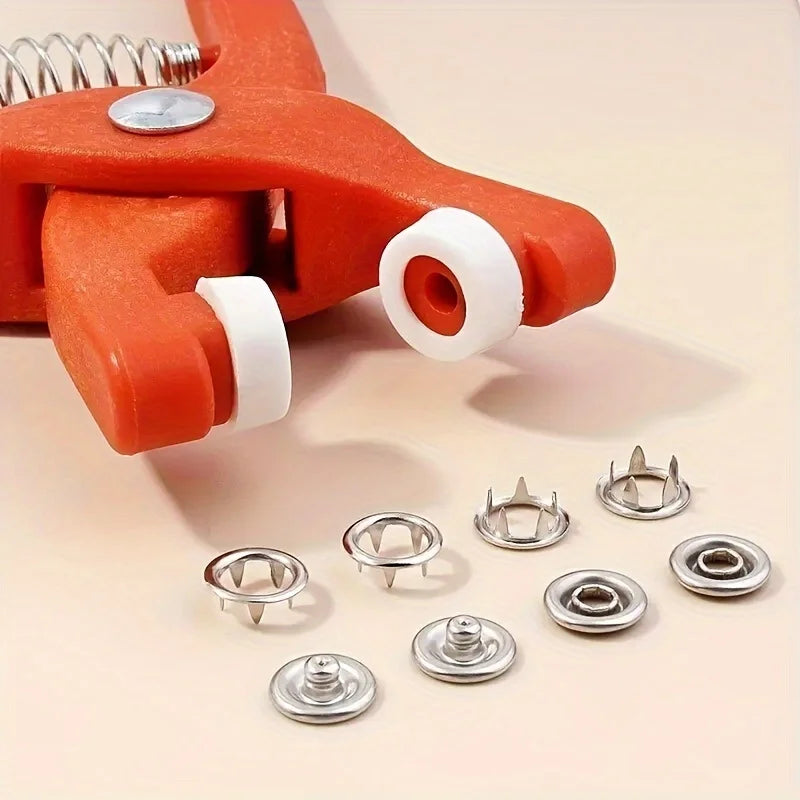 Orange precision snap button kit with various silver and white buttons for crafting