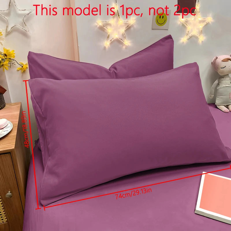 A purple matte solid color pillowcase is displayed on a bed with decorative star light fixtures.