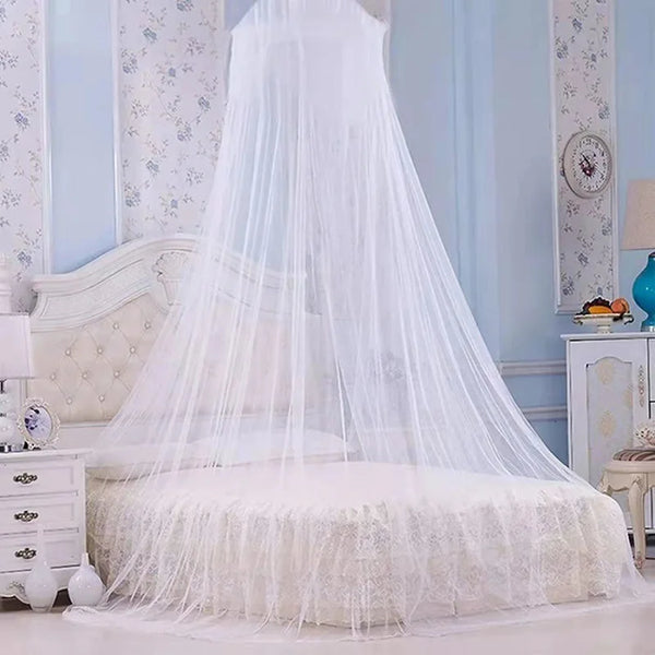 White sheer mosquito net draped over a bed, resembling a princess dome canopy.