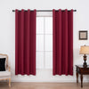 A set of two maroon blackout grommet curtains hanging on a window frame.