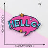 Pink embroidery patch with the word HELLO in blue stitching and gold stars on a pink background
