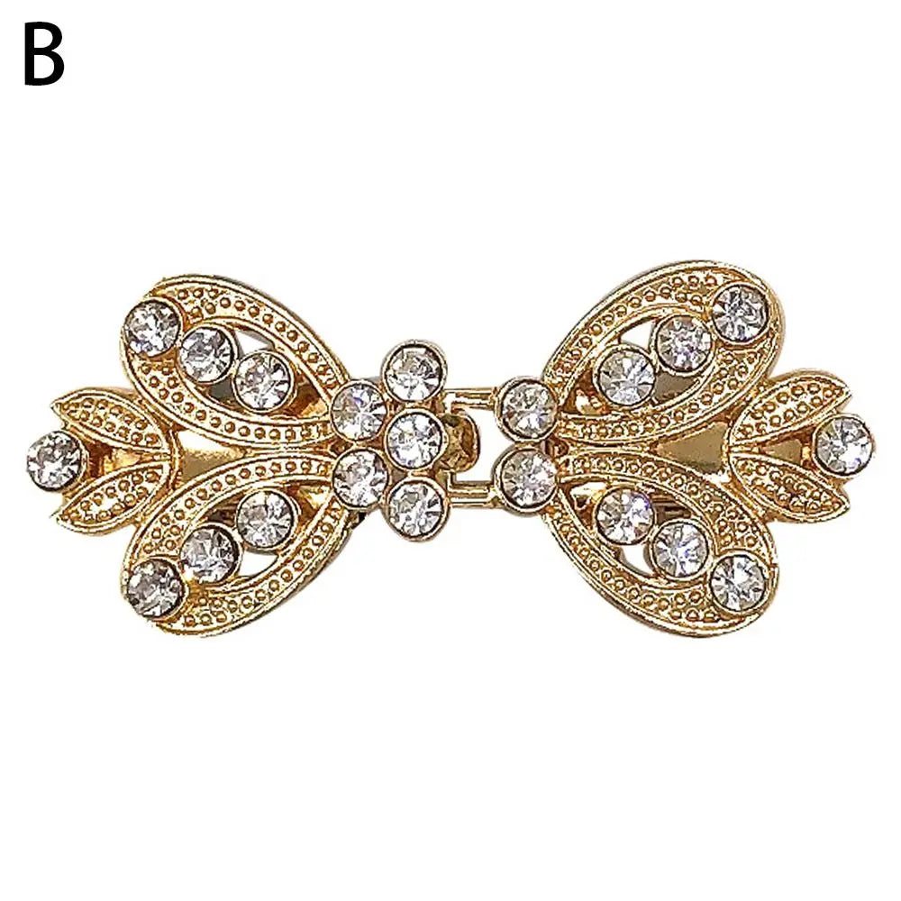 Gold vintage swirl clip brooch featuring clear rhinestones for scarves and clothing
