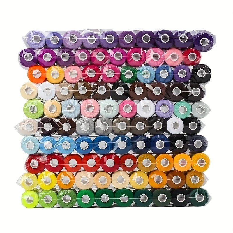A stack of 100 color polyester sewing thread spools arranged in rows.