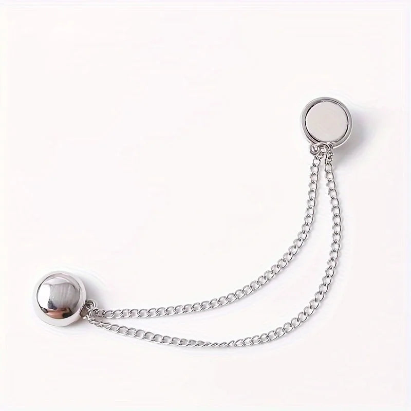 Silver adjustable hem t-shirt shortener with a chain and circular disc.
