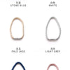 A collection of magnetic curtain tieback clips in various colors including stone blue, white, pale jade, light grey, sapphire