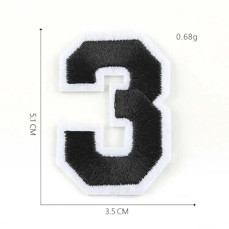 A black felt number 3 patch with white edges, measuring 5.1 cm high and 3.5 cm wide.