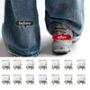Before and after comparison showing invisible pant hem clips used to adjust trouser hems.