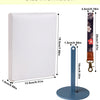 A white adjustable yarn holder and winder set with a wooden hanger and base.